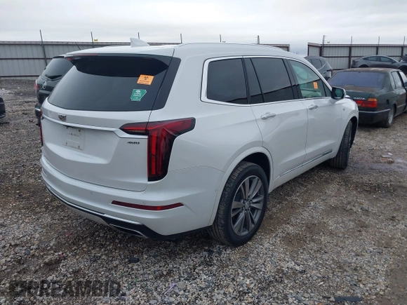 2021 Cadillac XT6 Premium Luxury with VIN 1GYKPFRS0MZ100879, listed as a IAAI auction lot 41083030 with 56,502 mi miles and . Bid and sale history available at DreamBid. Image 4.