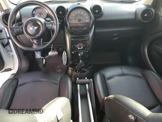 2016 MINI Countryman S with VIN WMWZC5C51GWU01290, listed as a Copart auction lot 77684384 with 106,811 mi miles and Salvage Title. Bid and sale history available at DreamBid. Image 8.