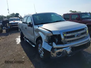 2014 Ford F-150 XL with VIN 1FTFW1ET9EFB97417, listed as a IAAI auction lot 42573951 with 122,907 mi miles and . Bid and sale history available at DreamBid. Image 1.
