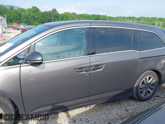 2014 Honda Odyssey Touring with VIN 5FNRL5H99EB111685, listed as a IAAI auction lot 42141227 with 183,484 mi miles and . Bid and sale history available at DreamBid. Image 14.