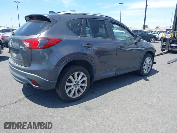 2014 Mazda CX-5 Grand Touring with VIN JM3KE4DY8E0391317, listed as a IAAI auction lot 41871641 with 77,048 mi miles. Bid and sale history available at carsss.com. Image 4.