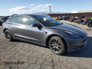 2023 Tesla Model 3 with VIN 5YJ3E1EA4PF556782, listed as a Copart auction lot 55626935 with 26,615 mi miles and Salvage title. Bid and sale history available at DreamBid. Image 4.