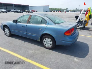 1999 Oldsmobile Alero GL z VIN 1G3NL52TXXC339892, wystawiony jako IAAI lot #41935539 z przebiegiem 315 555 mil mil oraz . Historia ofert i sprzedaży dostępna na DreamBid. Obrazek 3.