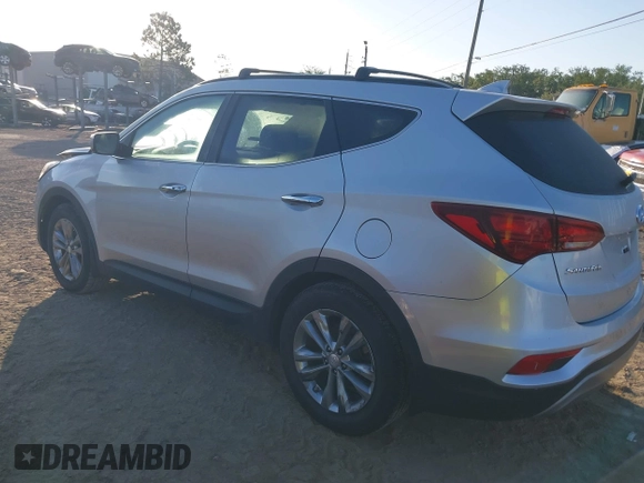 2018 Hyundai Santa Fe 2.0T z VIN 5XYZU4LA1JG516466, wystawiony jako IAAI lot #42265607 z przebiegiem 110 655 mil mil oraz . Historia ofert i sprzedaży dostępna na DreamBid. Obrazek 3.