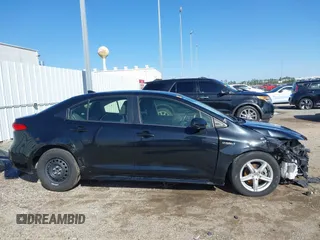 2021 Toyota Corolla Hybrid LE with VIN JTDEAMDE8MJ034218, listed as a IAAI auction lot 41692711 with 65,651 mi miles. Bid and sale history available at carsss.com. Image 14.