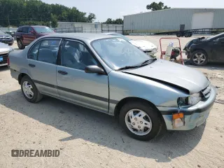 1994 Toyota Tercel DX z VIN JT2EL43T3R0489039, wystawiony jako Copart lot #67834034 z przebiegiem 139 726 mil mil oraz Szkody całkowita. Historia ofert i sprzedaży dostępna na DreamBid. Obrazek 4.