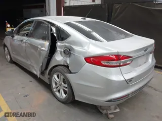2018 Ford Fusion Hybrid SE with VIN 3FA6P0LUXJR170152, listed as a IAAI auction lot 41467621 with 150,048 mi miles. Bid and sale history available at carsss.com. Image 3.