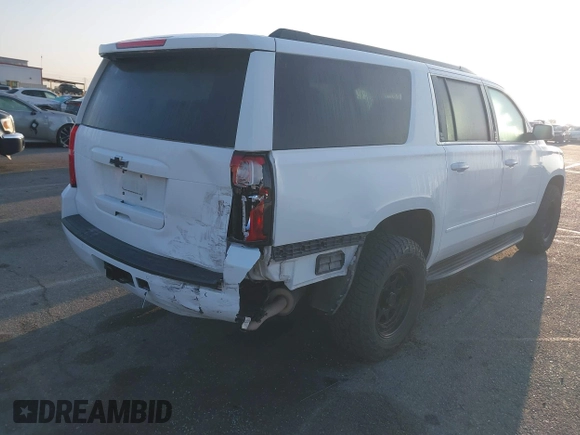 2018 Chevrolet Suburban LS with VIN 1GNSKGKC5JR173889, listed as a IAAI auction lot 42152865 with 73,358 mi miles and . Bid and sale history available at DreamBid. Image 4.