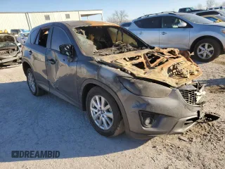 2015 Mazda CX-5 Touring with VIN JM3KE4CY4F0432335, listed as a Copart auction lot 83258294 with 0 mi miles and Non Repairable. Bid and sale history available at carsss.com. Image 4.