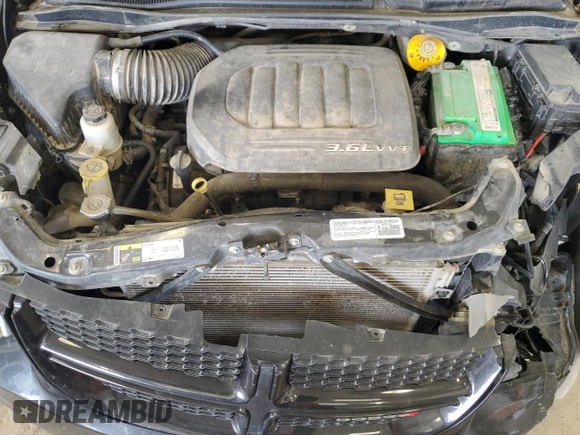2014 Dodge Grand Caravan SXT 30th Anniversary with VIN 2C4RDGCG1ER200489, listed as a Copart auction lot 52558915 with 127,035 mi miles and Salvage Title. Bid and sale history available at DreamBid. Image 12.