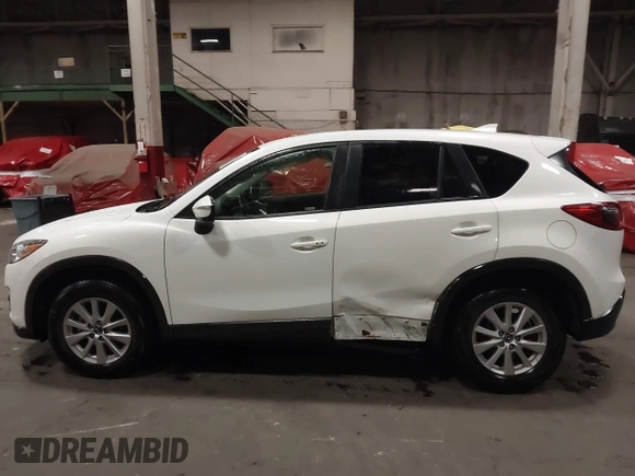 2016 Mazda CX-5 Touring z VIN JM3KE4CY0G0853261, wystawiony jako IAAI lot #41861176 z przebiegiem 63 491 mil mil oraz . Historia ofert i sprzedaży dostępna na DreamBid. Obrazek 14.