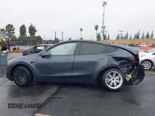 2024 Tesla Model Y Long Range with VIN 7SAYGDEE5RA241433, listed as a IAAI auction lot 41569277 with 7,490 mi miles. Bid and sale history available at carsss.com. Image 13.