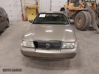 2004 Mercury Grand Marquis GS with VIN 2MEFM74W04X618043, listed as a IAAI auction lot 41985566 with 192,836 mi miles. Bid and sale history available at carsss.com. Image 6.