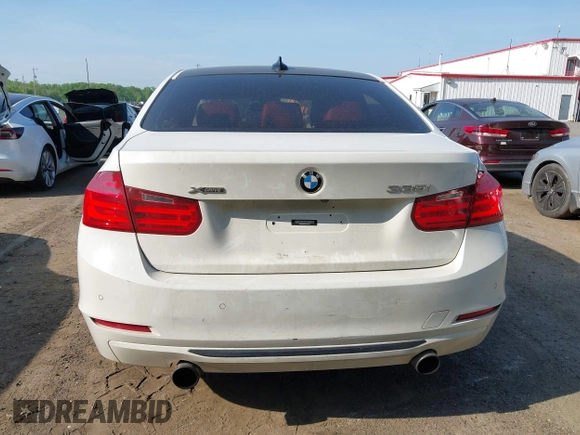 2013 BMW 3 Series 335i xDrive with VIN WBA3B9C54DF587421, listed as a IAAI auction lot 42165857 with 142,331 mi miles. Bid and sale history available at carsss.com. Image 16.