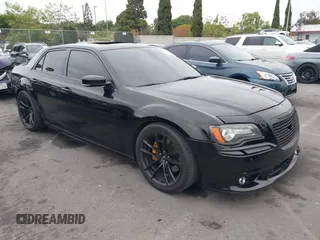 2013 Chrysler 300 SRT-8 with VIN 2C3CCAFJ9DH576184, listed as a IAAI auction lot 42162364 with 104,021 mi miles and . Bid and sale history available at carsss.com. Image 1.