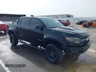 2018 Chevrolet Colorado 4WD ZR2 z VIN 1GCGTEEN2J1303106, wystawiony jako IAAI lot #42049877 z przebiegiem 61 954 mil mil oraz . Historia ofert i sprzedaży dostępna na DreamBid. Obrazek 1.
