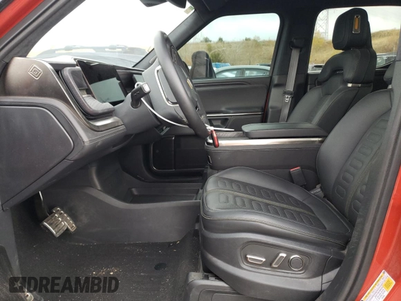 2023 Rivian R1T Adventure with VIN 7FCTGAAA2PN026211, listed as a Copart auction lot 77705414 with Not Provided miles and Salvage Title. Bid and sale history available at DreamBid. Image 7.