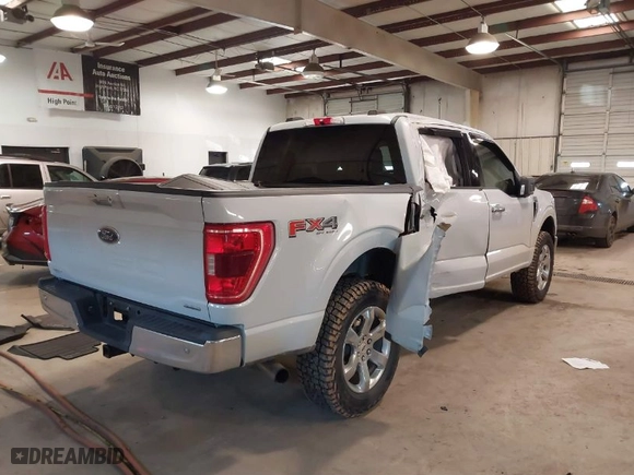 2021 Ford F-150 XL with VIN 1FTFW1E89MKD93309, listed as a IAAI auction lot 41413599 with 77,647 mi miles. Bid and sale history available at carsss.com. Image 4.