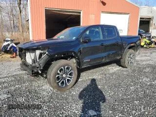 2024 GMC Canyon 4WD AT4 with VIN 1GTP6DEK2R1180037, listed as a Copart auction lot 85656994 with 7,565 mi miles and Salvage Title. Bid and sale history available at carsss.com. Image 1.