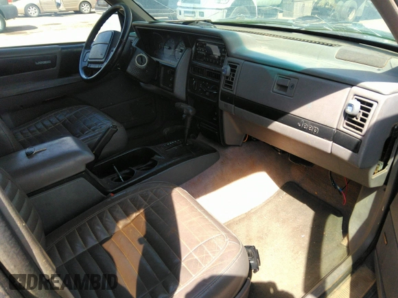 1994 Jeep Grand Cherokee Laredo with VIN 1J4GZ58Y3RC202638, listed as a IAAI auction lot 41885484 with 164,481 mi miles. Bid and sale history available at carsss.com. Image 5.