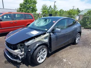 2023 Tesla Model Y Long Range with VIN 7SAYGAEE7PF615751, listed as a IAAI auction lot 42297819 with 31,201 mi miles and . Bid and sale history available at DreamBid. Image 2.