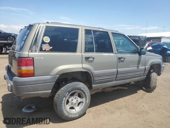 1997 Jeep Grand Cherokee Laredo z VIN 1J4GZ58S6VC636803, wystawiony jako Copart lot #59977115 z przebiegiem Nie podano mil oraz Szkoda całkowita • Salvage title. Historia ofert i sprzedaży dostępna na DreamBid. Obrazek 3.