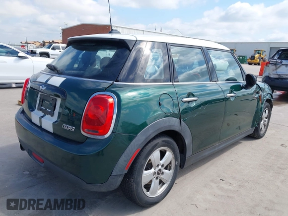 2016 MINI Hardtop 4 Door with VIN WMWXU1C52G2D10035, listed as a IAAI auction lot 42190544 with 106,383 mi miles and . Bid and sale history available at DreamBid. Image 4.