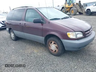 1999 Toyota Sienna LE with VIN 4T3ZF13C7XU152879, listed as a IAAI auction lot 41974953 with 201,644 mi miles. Bid and sale history available at carsss.com. Image 1.