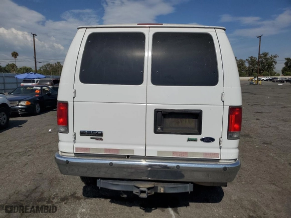 2014 Ford Econoline Wagon XL with VIN 1FBNE3BLXEDA14976, listed as a Copart auction lot 65948404 with 285,655 mi miles and Salvage Title. Bid and sale history available at carsss.com. Image 6.