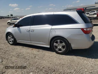2012 Honda Odyssey Touring with VIN 5FNRL5H94CB009952, listed as a Copart auction lot 54322695 with 135,551 mi miles and Salvage title. Bid and sale history available at DreamBid. Image 2.