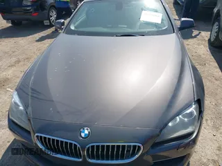 2012 BMW 6 Series 650i z VIN WBALX3C57CC528832, wystawiony jako IAAI lot #41779268 z przebiegiem 75 119 mil mil oraz . Historia ofert i sprzedaży dostępna na DreamBid. Obrazek 12.