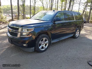 2015 Chevrolet Suburban LT with VIN 1GNSKJKC0FR238524, listed as a IAAI auction lot 42046889 with 179,676 mi miles. Bid and sale history available at carsss.com. Image 2.