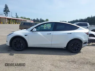 2023 Tesla Model Y Long Range with VIN 7SAYGDEE4PF676167, listed as a IAAI auction lot 42147909 with 20,488 mi miles. Bid and sale history available at carsss.com. Image 15.