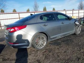 2013 Kia Optima SX w/Limited Pkg with VIN 5XXGR4A67DG191290, listed as a IAAI auction lot 41864684 with 136,525 mi miles. Bid and sale history available at carsss.com. Image 4.