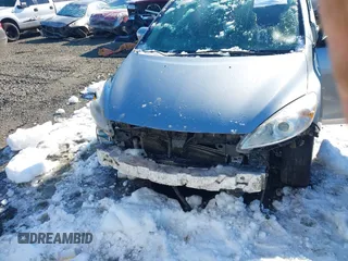 2014 Mazda 5 Sport with VIN JM1CW2BLXE0168119, listed as a IAAI auction lot 41527688 with 142,357 mi miles and . Bid and sale history available at DreamBid. Image 6.