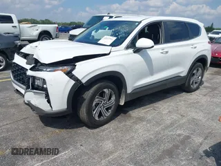 2023 Hyundai Santa Fe SE z VIN 5NMS14AJ6PH631267, wystawiony jako IAAI lot #42053761 z przebiegiem 17 880 mil mil oraz . Historia ofert i sprzedaży dostępna na DreamBid. Obrazek 2.
