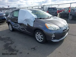 2013 Toyota Prius c One with VIN JTDKDTB33D1038957, listed as a IAAI auction lot 41485355 with 102,999 mi miles. Bid and sale history available at carsss.com. Image 1.