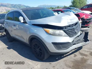 2012 Kia Sportage LX with VIN KNDPBCA21C7232807, listed as a IAAI auction lot 42419020 with 121,422 mi miles and . Bid and sale history available at DreamBid. Image 1.