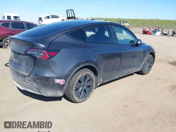 2024 Tesla Model Y with VIN 7SAYGDED8RF213796, listed as a IAAI auction lot 41634130 with 7,710 mi miles and . Bid and sale history available at DreamBid. Image 4.