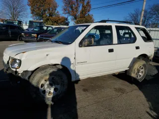 1999 Isuzu Rodeo S with VIN 4S2CK58W5X4355055, listed as a Copart auction lot 82044004 with 165,741 mi miles and Salvage Title. Bid and sale history available at carsss.com. Image 1.