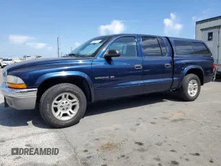 2001 Dodge Dakota z VIN 1B7HL2AX31S278317, wystawiony jako Copart lot #55467745 z przebiegiem 86 799 mil mil oraz Czysty tytuł • Clean title. Historia ofert i sprzedaży dostępna na DreamBid. Obrazek 1.