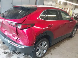 2023 Mazda CX-30 S Premium with VIN 3MVDMBDM5PM518612, listed as a IAAI auction lot 42219265 with 29,135 mi miles and . Bid and sale history available at DreamBid. Image 4.