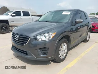 2016 Mazda CX-5 Sport with VIN JM3KE4BY8G0921243, listed as a IAAI auction lot 42102663 with 111,960 mi miles and . Bid and sale history available at DreamBid. Image 2.