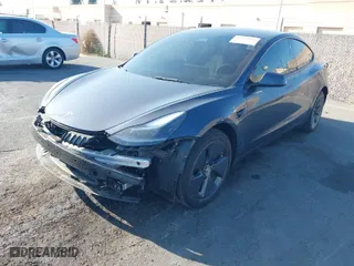 2023 Tesla Model 3 Long Range with VIN 5YJ3E1EB0PF635438, listed as a IAAI auction lot 41630945 with 48,801 mi miles. Bid and sale history available at carsss.com. Image 2.