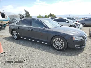 2015 Audi A8 4.0T z VIN WAU32AFD1FN012156, wystawiony jako Copart lot #52759185 z przebiegiem 117 498 mil mil oraz Szkody całkowita. Historia ofert i sprzedaży dostępna na DreamBid. Obrazek 4.