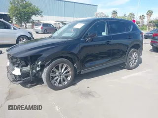 2021 Mazda CX-5 Grand Touring with VIN JM3KFBDM4M1426197, listed as a IAAI auction lot 42004644 with 43,814 mi miles. Bid and sale history available at carsss.com. Image 22.