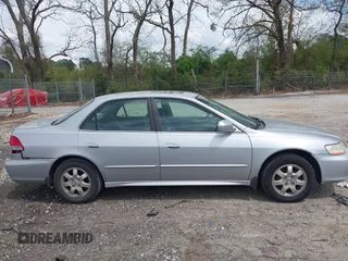 2002 Honda Accord EX z VIN 1HGCG56642A161161, wystawiony jako IAAI lot #41966381 z przebiegiem 258 103 mil mil oraz . Historia ofert i sprzedaży dostępna na DreamBid. Obrazek 13.