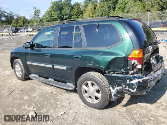 2003 GMC Envoy SLT with VIN 1GKDT13S032396374, listed as a Copart auction lot 74675134 with 115,280 mi miles and Salvage Title. Bid and sale history available at DreamBid. Image 2.