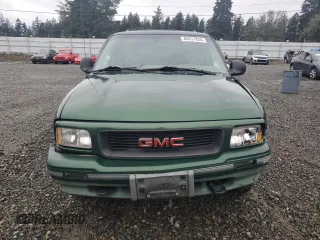 1997 GMC Jimmy SLS with VIN 1GKDT13WXV2563104, listed as a Copart auction lot 86317834 with 121,791 mi miles and Salvage Title. Bid and sale history available at carsss.com. Image 5.