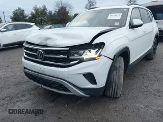 2022 Volkswagen Atlas SE z VIN 1V2KR2CA1NC555087, wystawiony jako IAAI lot #40921013 z przebiegiem 62 834 mil mil oraz . Historia ofert i sprzedaży dostępna na DreamBid. Obrazek 6.